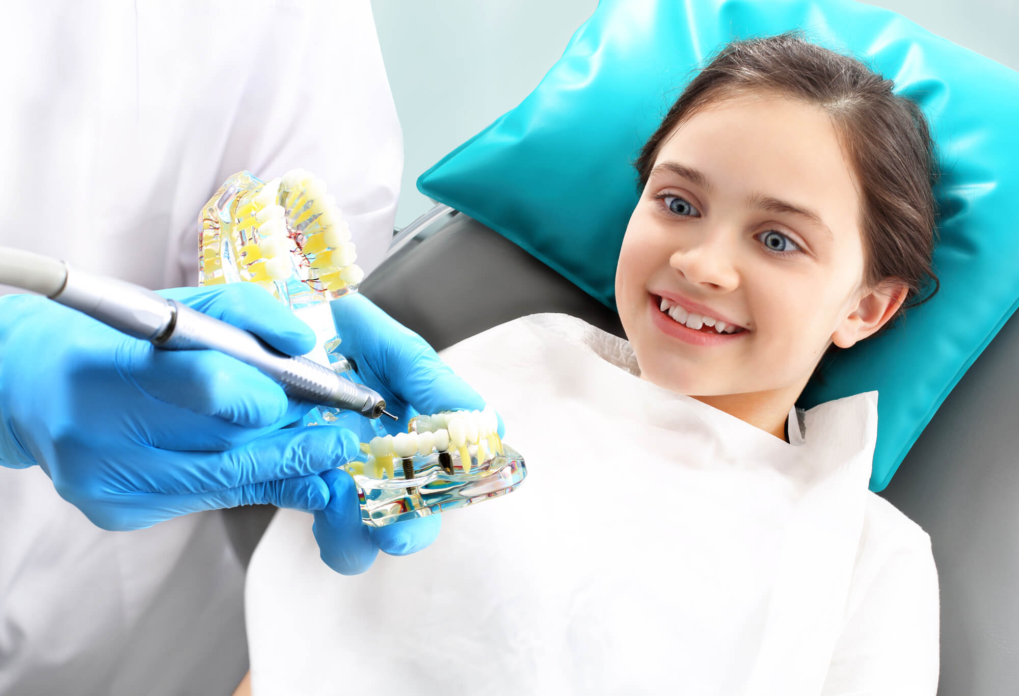dentist discussing fluoride treatment in Coral Gables